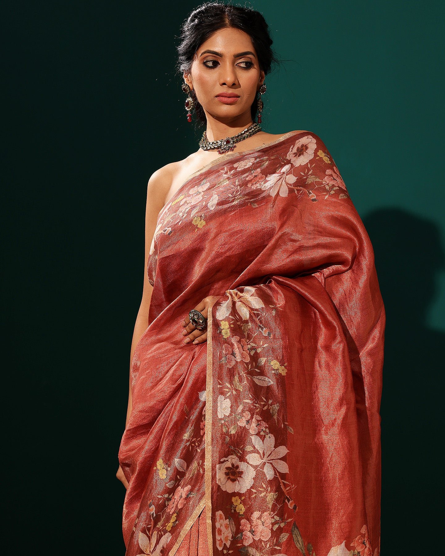 A red-striped silk saree typically features bold